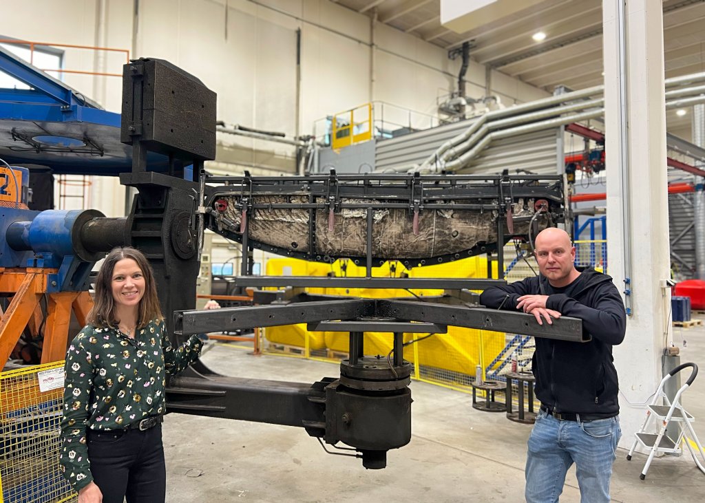 Kristine E. Mølmshaug, Quality and Sustainability Manager at Ovun and Daniel Viklund, one of the engineers involved in the project stand beside the recycled MDPE hull mould of the Otter USV.