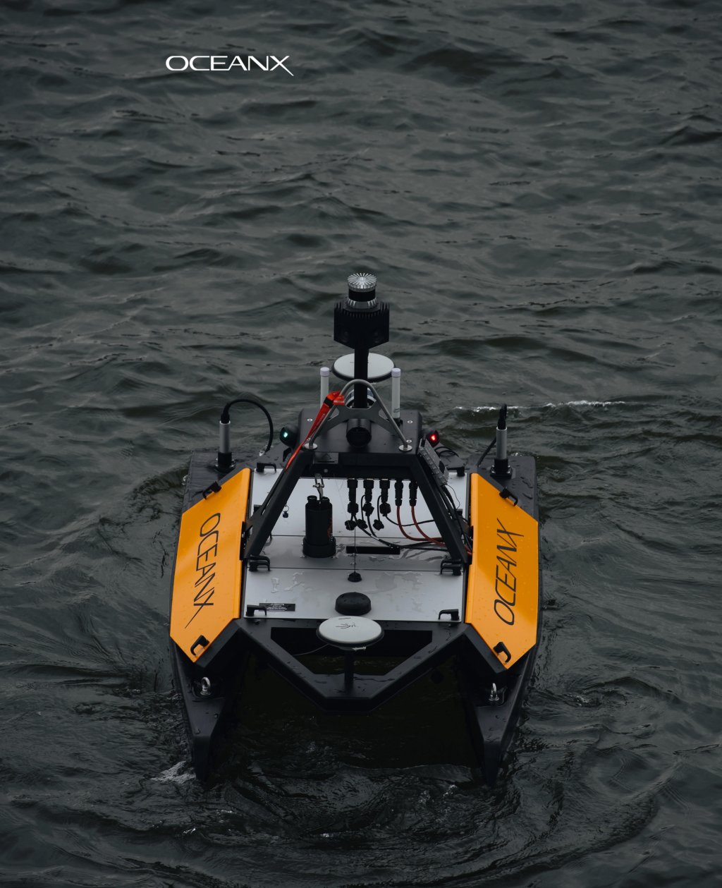 Front view of the Otter USV vessel with the SeaSight addon in the water.