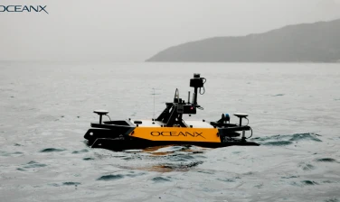 Left side view of the Otter USV vessel with the SeaSight add-on in the coastal ocean.